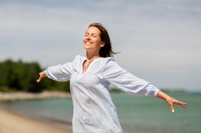 woman happy after chiropractic care treatment