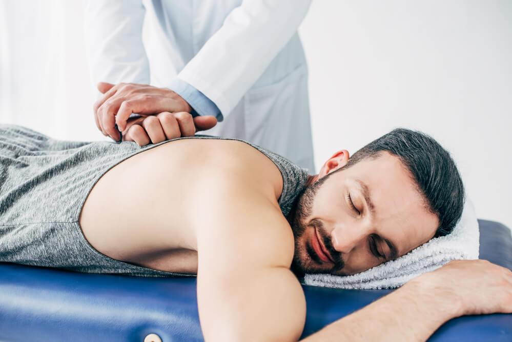 man receiving a chiropractic adjustment