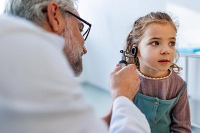 Pediatrician-Examines-Child's-Ears-for-Any-Signs-of-Infection