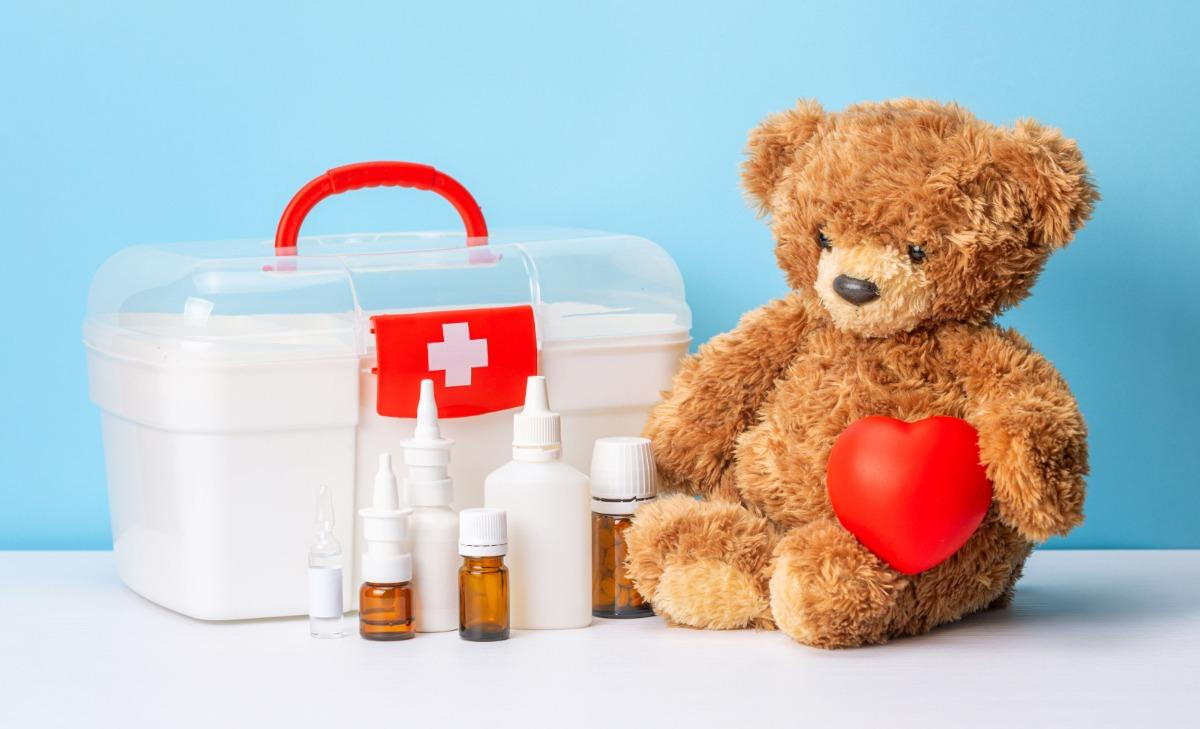 Complete pediatric first aid kit with child-friendly medical supplies, bandages, and emergency equipment organized for easy access