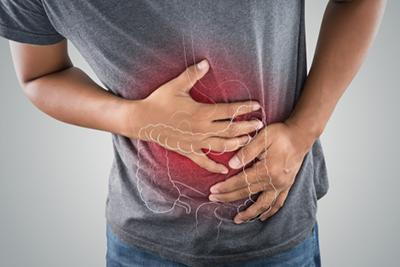 Man in visible pain from ulcerative colitis flare-up