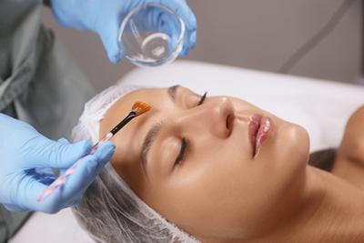 Dermatologist-Applying-Chemical-Peels-on-Client's-Face