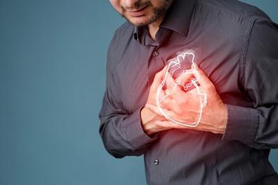 Man suffering from heart attach with 3d graphics illustration