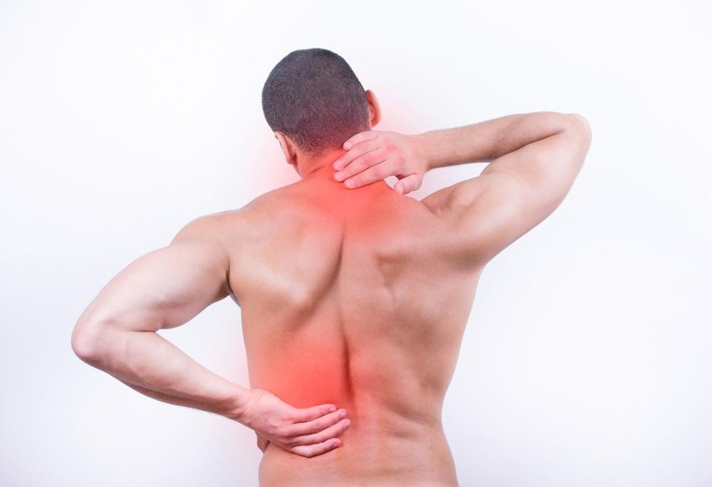 man enduring back and neck pain