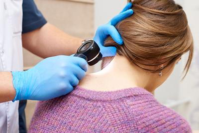 Procedure of skin exam on derma clinic