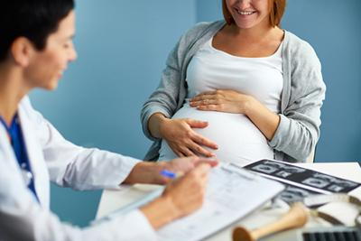 Pregnant woman visit the Obgyn on clinic.