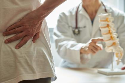 Male-Client-with-SPine-Problem-Visits-Orthopedic-Spine-Surgeon