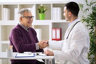 Older gentleman checking in at urgent care or walk-in clinic