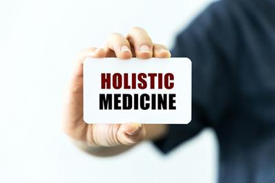 Concept image of holistic meds hold by a man