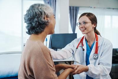 Primary-Care-Doctor-Smiling-at-Her-Patient