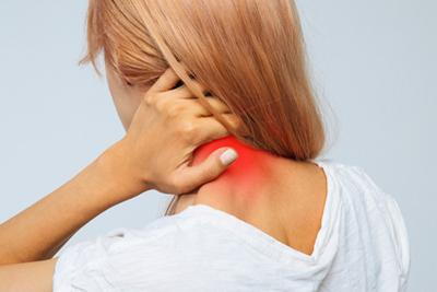 Woman holding her neck in pain with red highlights.