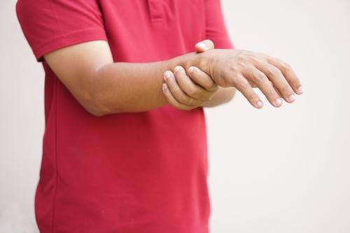 Illustration of Muscle Weakness on persons hand