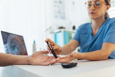 Doctor-Taking-Blood-Sample-for-Blood-Sugar-Meter