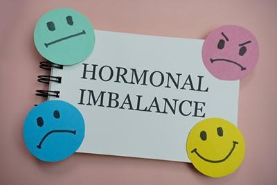 Educational concept of how hormonal imbalance can affect mood and emotions