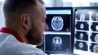 Doctor-check-the-result-in-the-monitor-from-patient.