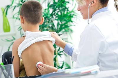 Doctor check the young boy on clinic