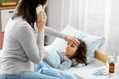 Mother-Touching-the-Forehead-of-her-Daughter's-Fever
