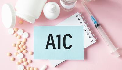 A1c in notes with tables and medical accessories.