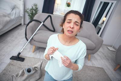 House cleaning causing dust-related allergy in a woman