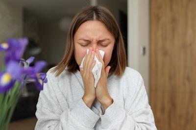 Woman suffering from allergies indoor