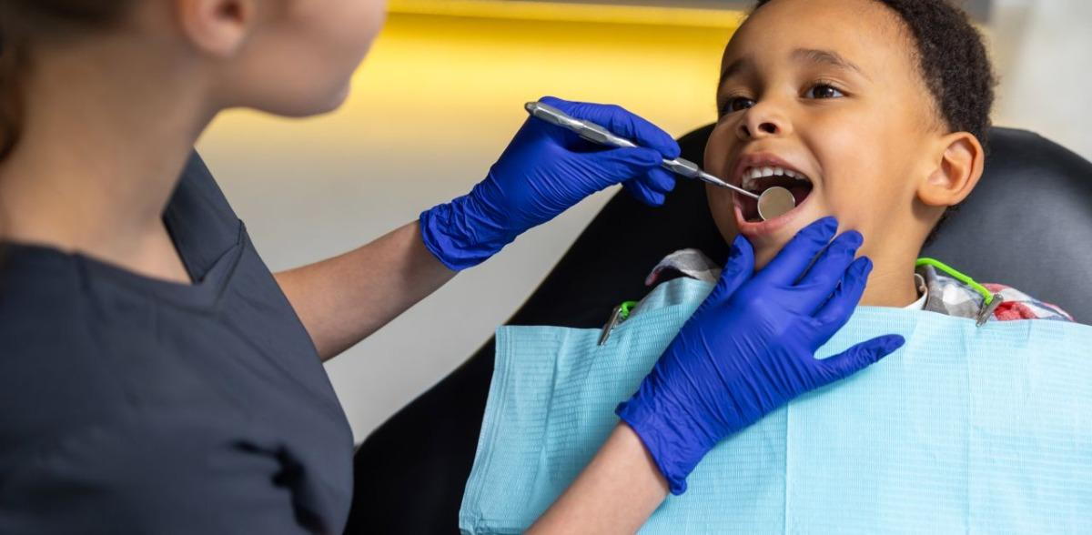 Kid getting dental treatment