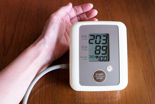 Hypertension indicated on digital blood pressure monitor
