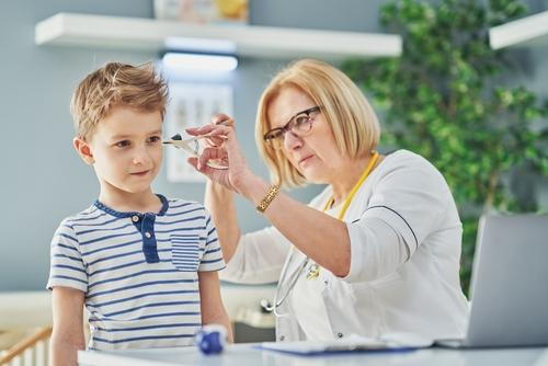 ENT doctor examining child's ear infection