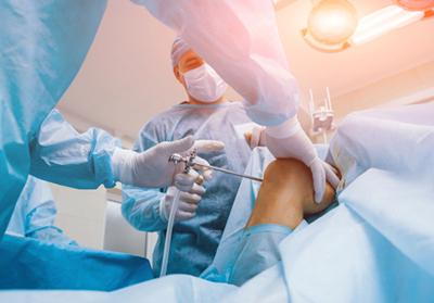 Man receiving minimally invasive knee surgery to improve joint function