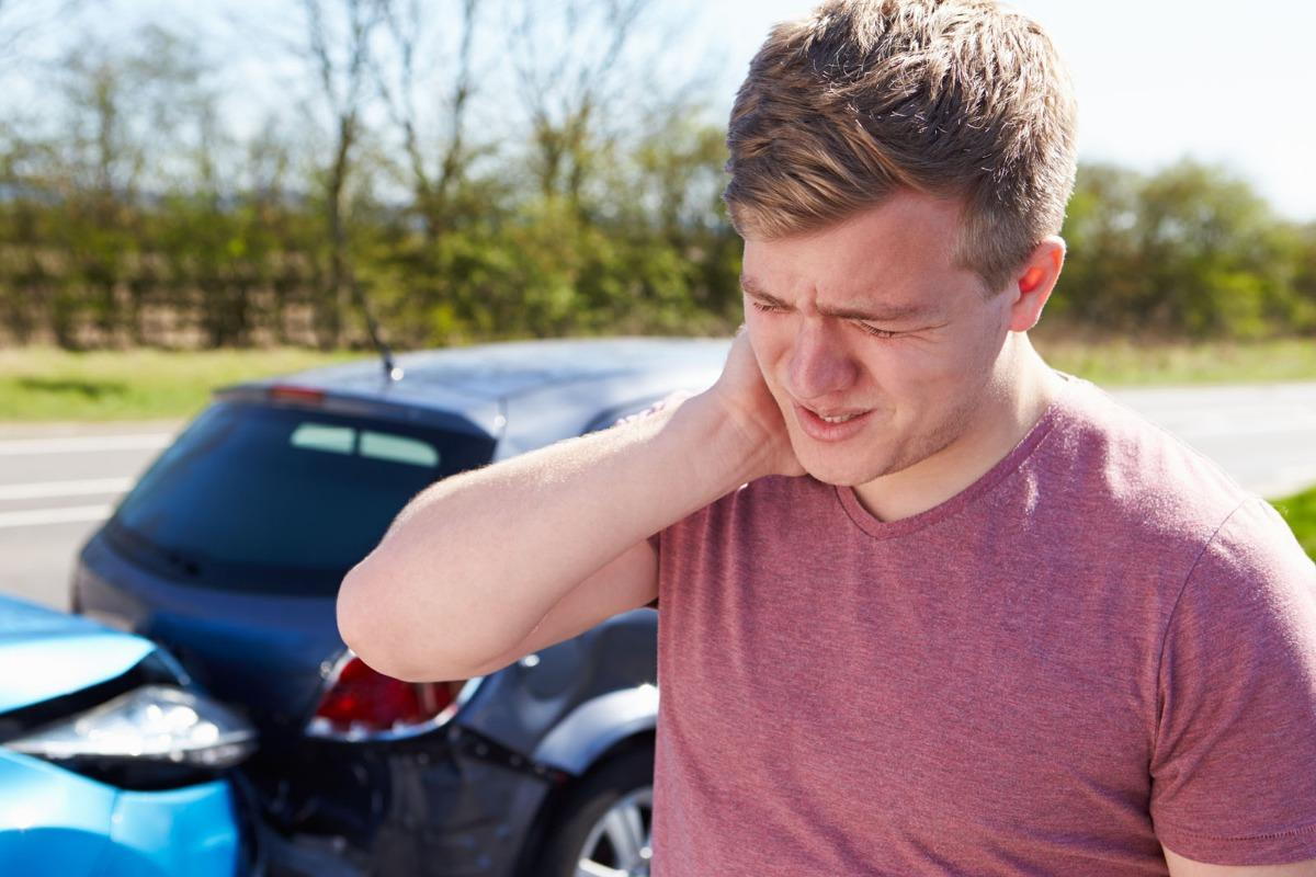man suffering from whiplash after an auto accident