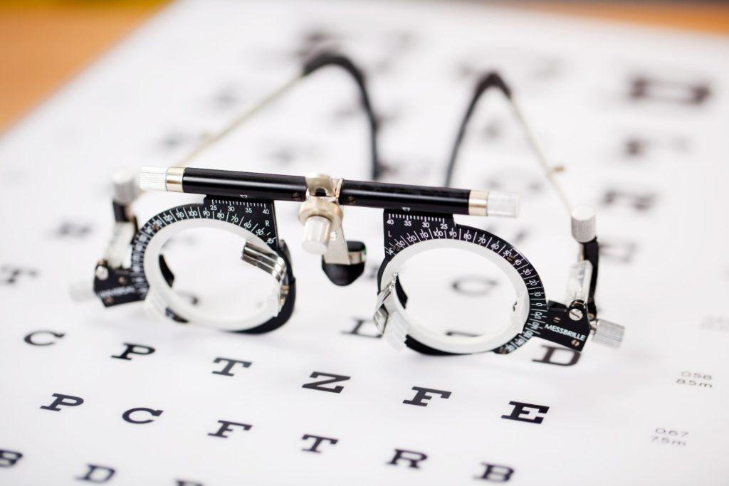 Eye Glasses Machine On Top Of An Eye Chart-  What Does EyeMed Insurance Cover Pensacola- Fifty Dollar Eye Guy 5328 N Davis Hwy Pensacola, FL 32503 (850) 434-6387