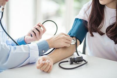 Doctor-Checking-Woman's-Blood-Pressure