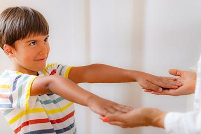 Young boy in School physical exam