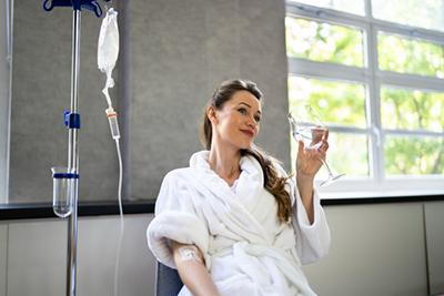 Woman under Infusion Therapy Session
