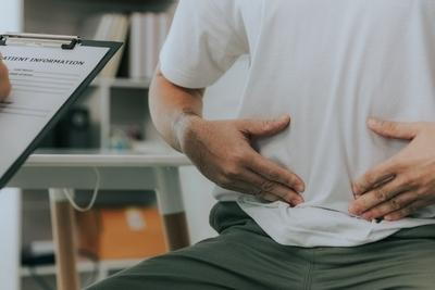 Man consulting in the doctor with Diverticulitis