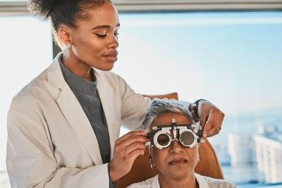 Doctor with the senior woman in eye exam on clinic