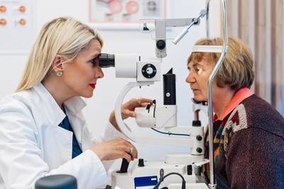 Ophthalmologist checking the patient's eye