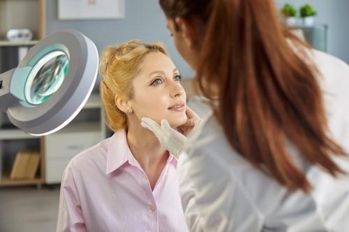 Female patient visiting dermatologist for skin concern