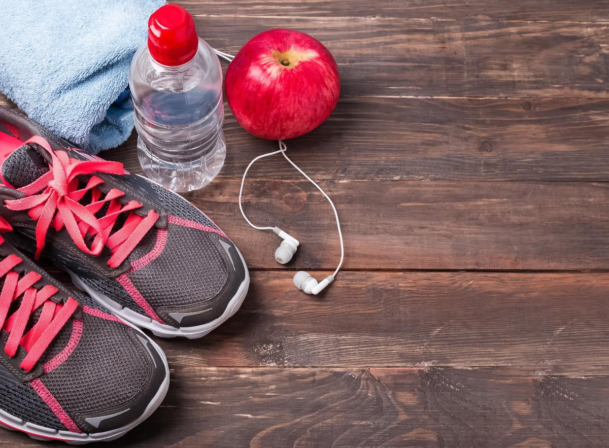 Running shoes, water bottle and ear phones