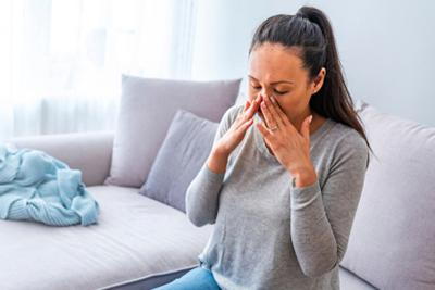 Woman suffering from sinusitis.
