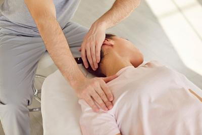 Female-Client-Receives-Neck-Pain-Relief-from-Massage-Therapist