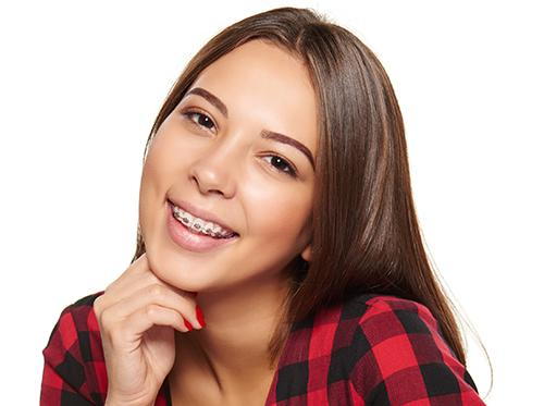 Young adult girl wearing braces