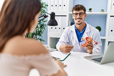 Woman-Visits-OBGYN-Doctor