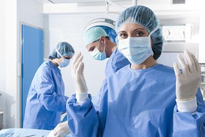 Doctor in Surgical Room with gloves.