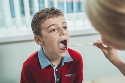 Child's-Doctor-Examines-Child's-Throat