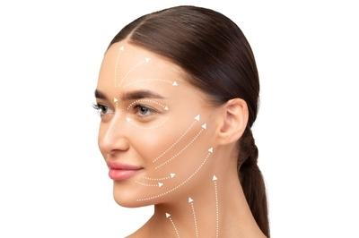Flawless face of woman with arrow of procedure for facelift