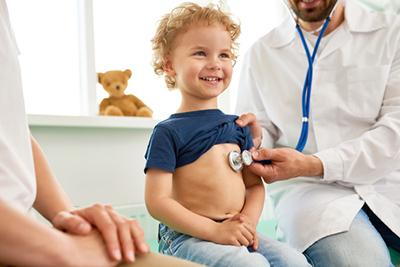 Annual wellness visit with a pediatrician and young patient