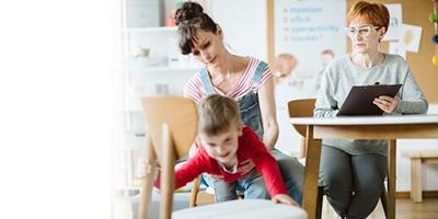 Child with signs of ADHD being assessed with mom present in therapy