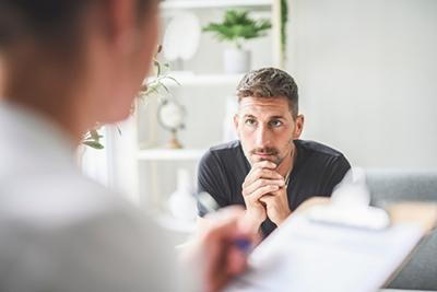 Therapist supporting man with eating disorder
