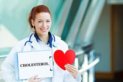 Specialist holding clipboard focused on cholesterol management