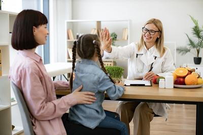 Pediatrician-Gives-High-Five-to-Kid